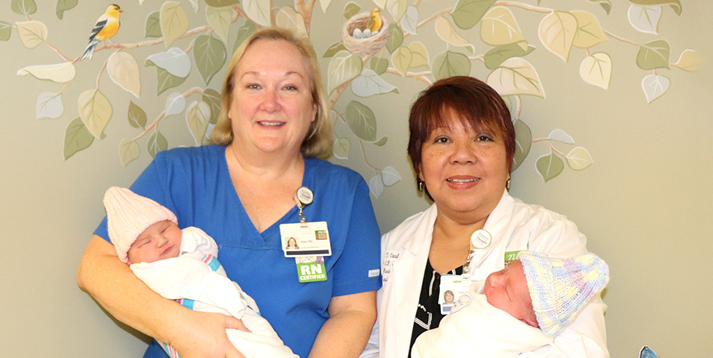 Acute Care Staff Nurse Mary Schubert, left, and Nenette Cacal, Clinical Nurse Manager, hold newborn bundles of joy, delivered in September.